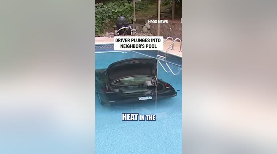 WATCH: Driver PLUNGES into neighbor's pool