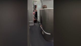 American Airlines passenger restrained, knocked down while trying to enter pilot cockpit: video