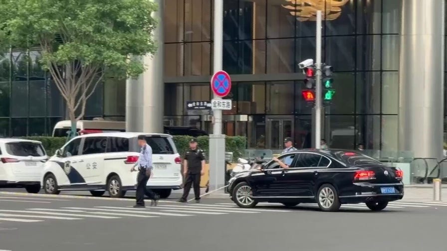 Video shows massive hole in building after plane reportedly crashes into Beijing skyscraper