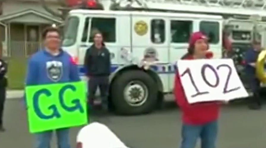 Police officers deliver sweet surprise for woman's 102nd birthday