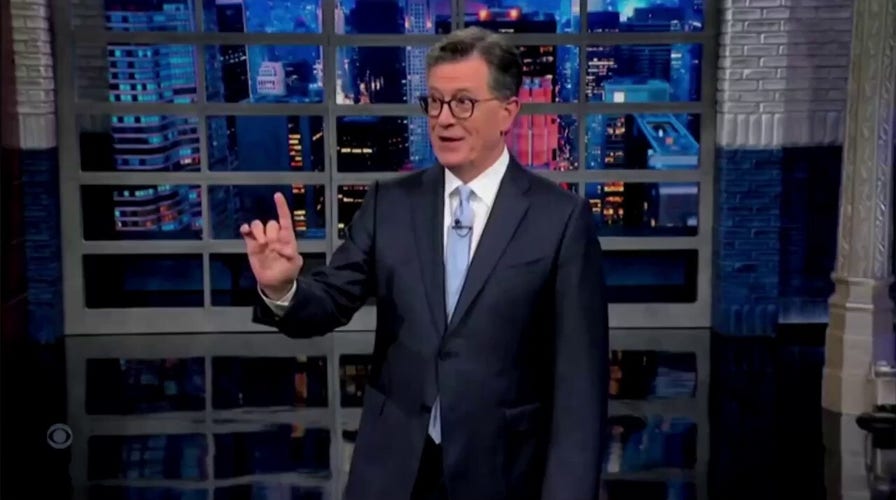 Colbert's audience boos as he declares Trump is 'very much alive'