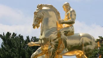 WATCH: Massive gold horse statues finally revealed after months behind scaffolding