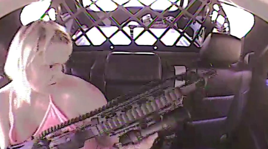 Oklahoma woman slips out of cuffs, shoots man and deputy from back of police cruiser, video shows