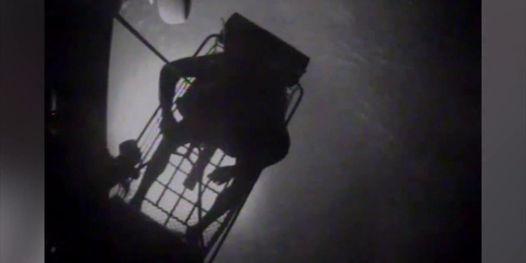 Dramatic footage shows the US Coast Guard rescuing a family of three off the coast of the Bahamas