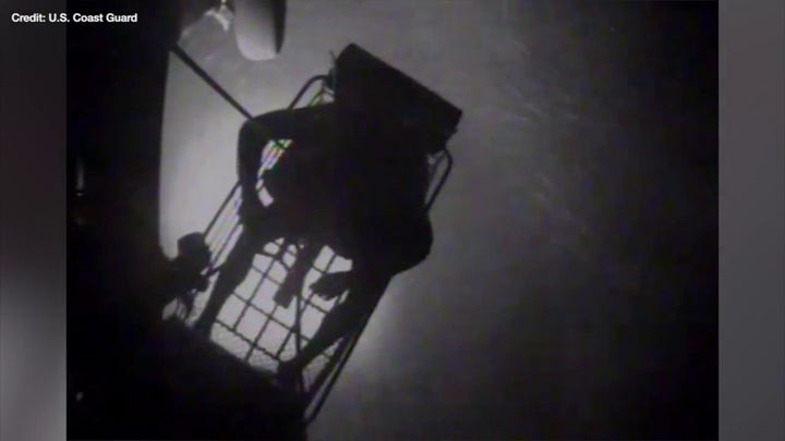 Dramatic footage shows the US Coast Guard rescuing a family of three off the coast of the Bahamas