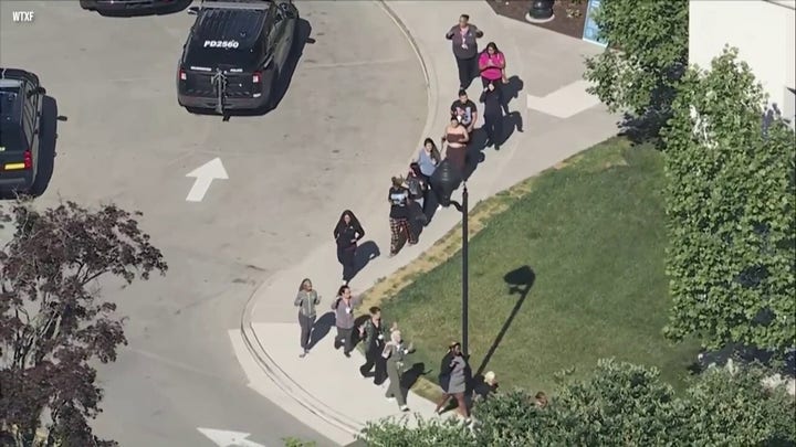 Hospital staff, visitors exit with hands raised after shooting in Delaware