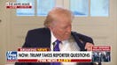 President Trump shows off his 'Happy Trump' pin