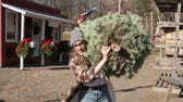 Kat tries cutting down a Christmas tree