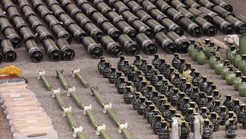 Kosovo show weapons seized after recent siege
