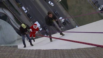 FOX News' Adam Klotz ropes down down 22-story building in annual 'Santa Rappel'