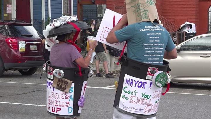 New Orleans residents hold 'trash parade' protest after garbage pickup delayed 3 weeks post Hurricane Ida