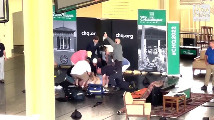 Author Salman Rushdie is tended to after he was attacked during a lecture at the Chautauqua Institution in Chautauqua, N.Y. (Courtesy: Dr. Chip Howard)