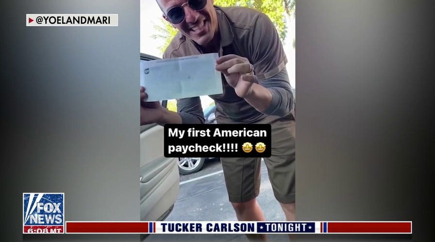 Cuban immigrant UPS driver celebrates first American paycheck