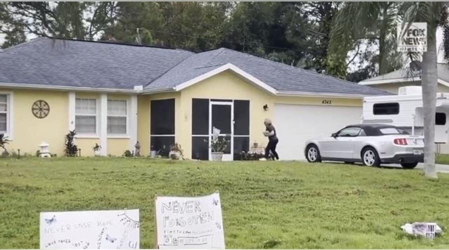 A protester on Sunday put photos of Gabby Petito around the home of Brian Laundrie’s parents
