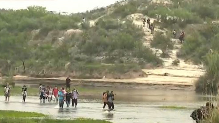 Exclusive video: Migrants cross border in dangerous waters as crisis intensifies