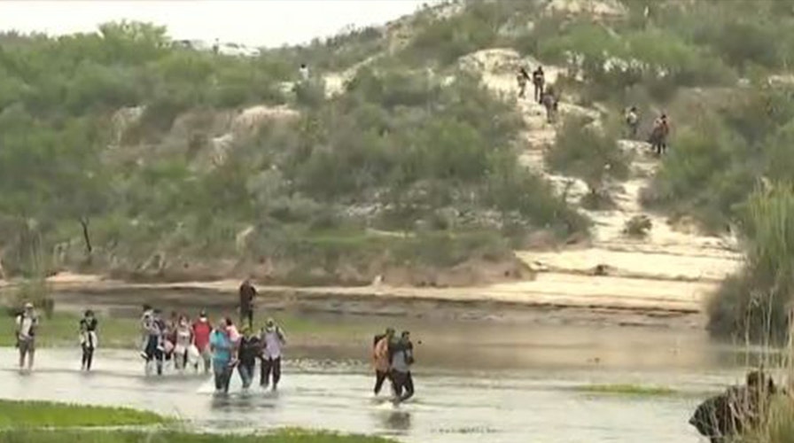 Exclusive video: Migrants cross border in dangerous waters as crisis intensifies