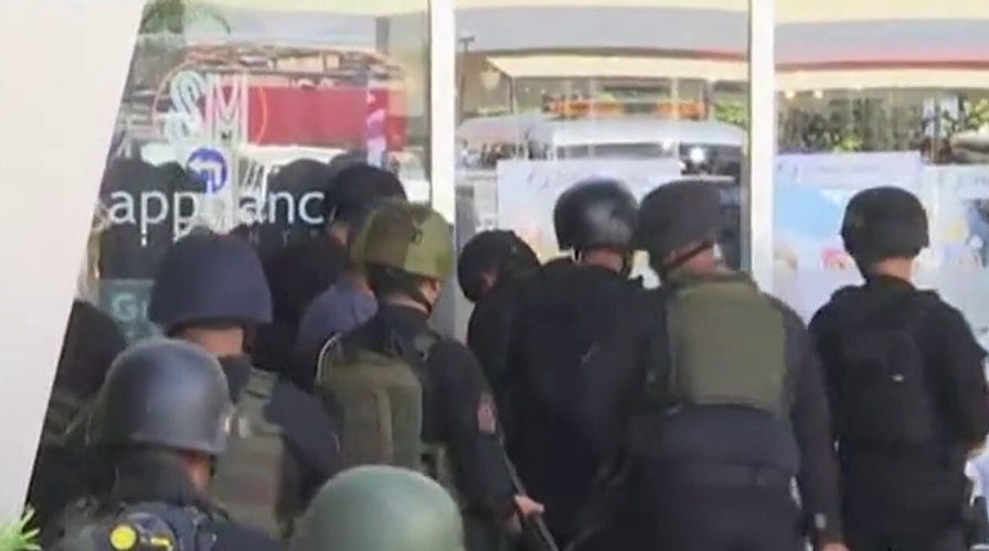 Fired security guard takes hostages at shopping mall in Philippines