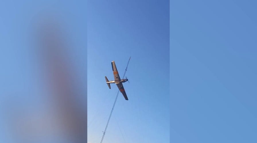 Scary moment when airplane hits metal antenna while pilot performs stunts