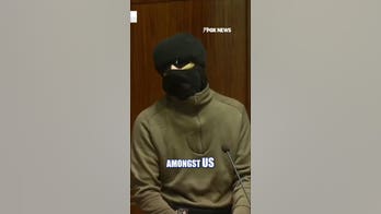 Masked activist rails against 'settler colony' in bizarre rant