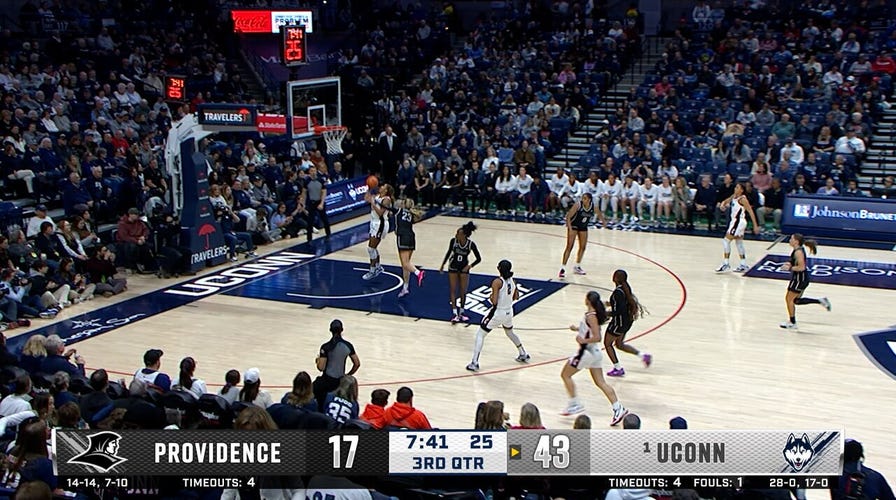 UConn's Sarah Strong forces the turnover and finishes the fast break vs. Providence