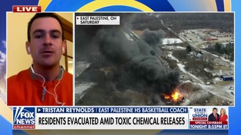 Ohio residents flee as authorities release chemicals from derailed train
