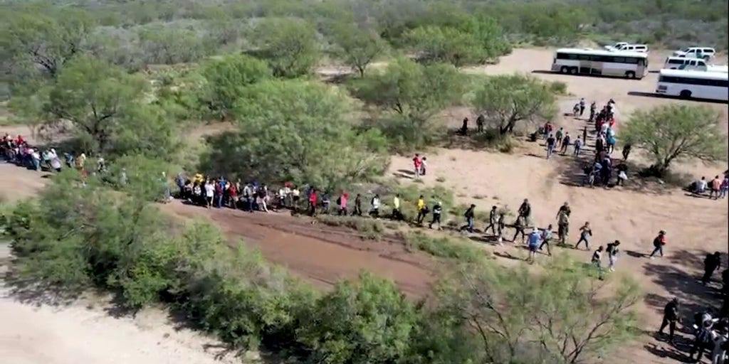 Drone Footage Shows A Large Group Of Migrants Crossing The US-Mexico ...