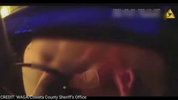 Georgia authorities rescue motorist from burning SUV in heart-stopping footage