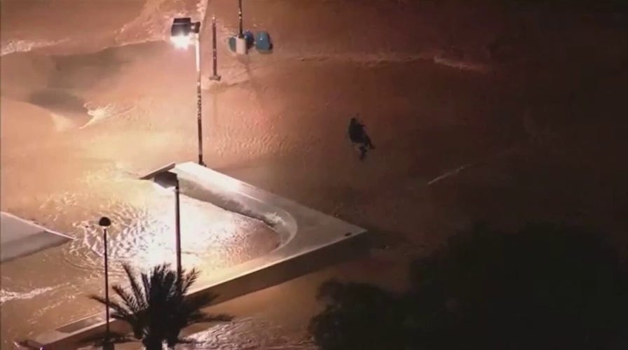 Arizona fire crews rescue stranded woman during Scottsdale storm; husband reacts