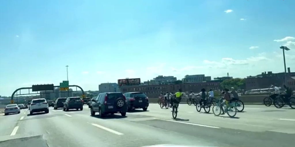 Bikers flood Boston highway, one crashes into police cruiser during wild takeover