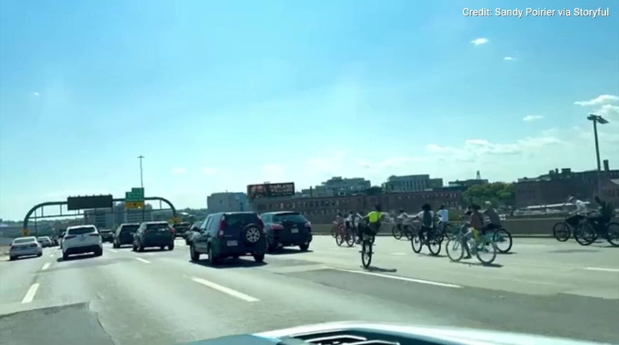Bikers flood Boston highway, one crashes into police cruiser during wild takeover