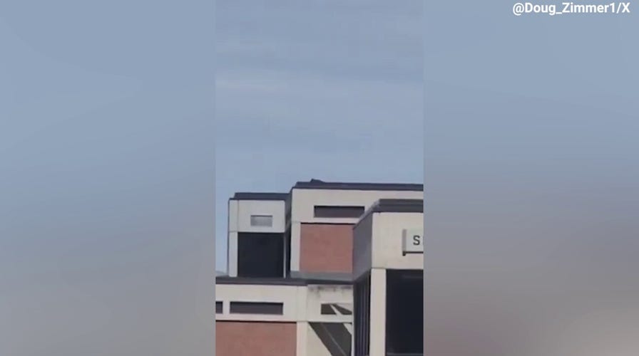 Video shows what appears to be person on roof of building at UVU