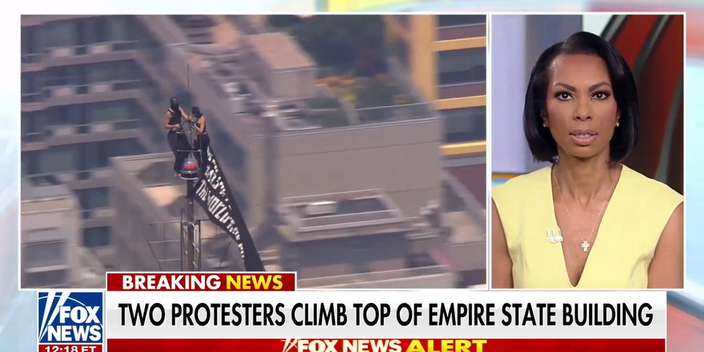 Protesters climb Empire State Building spire