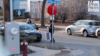 Party for Socialism and Liberation's Twin Cities chapter readies pre-made signs for 'No Kings' protest