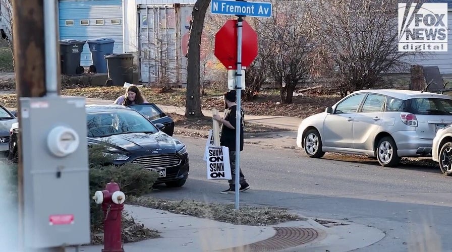 Party for Socialism and Liberation's Twin Cities chapter readies pre-made signs for 'No Kings' protest