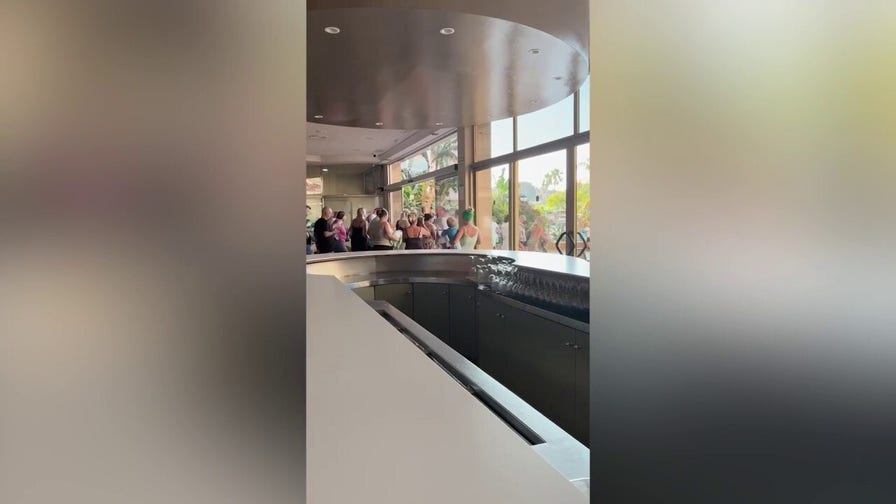 Vacationers sprint for pool loungers in chaotic daily race at packed Spanish resort