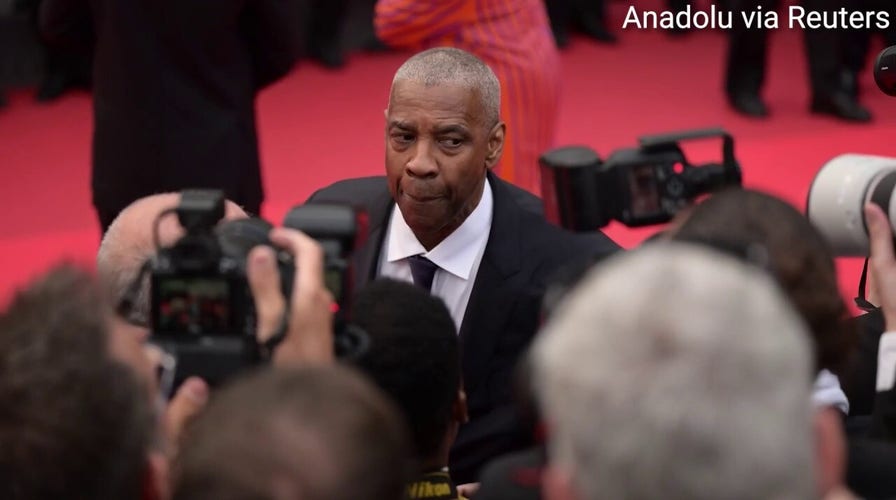 Denzel Washington erupts after photographer appears to grab him on Cannes red carpet