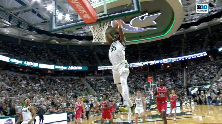 Michigan State's Coen Carr elevates for almighty  alley-oop decorativeness  against Detroit Mercy