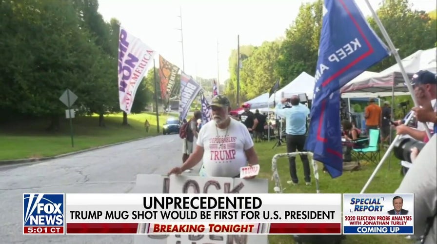 Trump supporters rally outside jail as he expects to turn himself in
