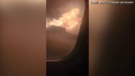 Flames shoot from Air Canada plane wing during landing