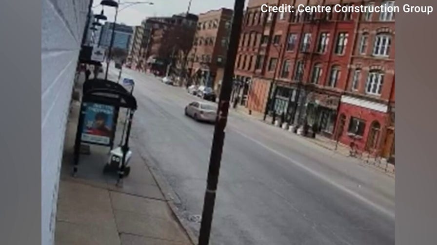 Video shows delivery robot crash into bus stop glass in Chicago