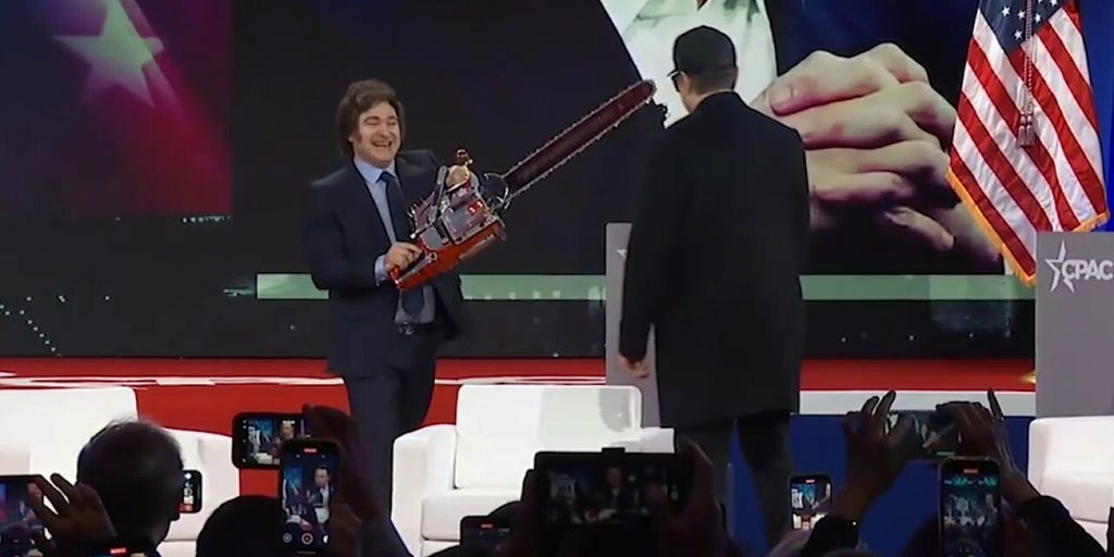 Javier Milei Gifts Elon Musk with Blinged-Out DOGE Chainsaw