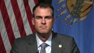 Gun control is 'total overreach' by federal government: Gov. Stitt