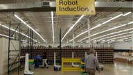 How this company uses robots while paying its human workers higher wages 
