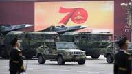 China marks milestone by showing off new missiles 