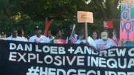 Protesters picket outside Dan Loeb’s Hampton home