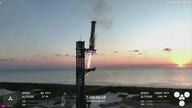 SpaceX arm 'catches' Super Heavy rocket booster
