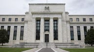 Fed holds rates near zero, signals increase is imminent to curb inflation
