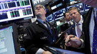 Dow closes above 18K for first time since July