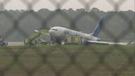 United Airlines flight skids off Houston runway