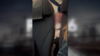 Passenger attempts to open plane door mid-flight while experiencing in medical crisis